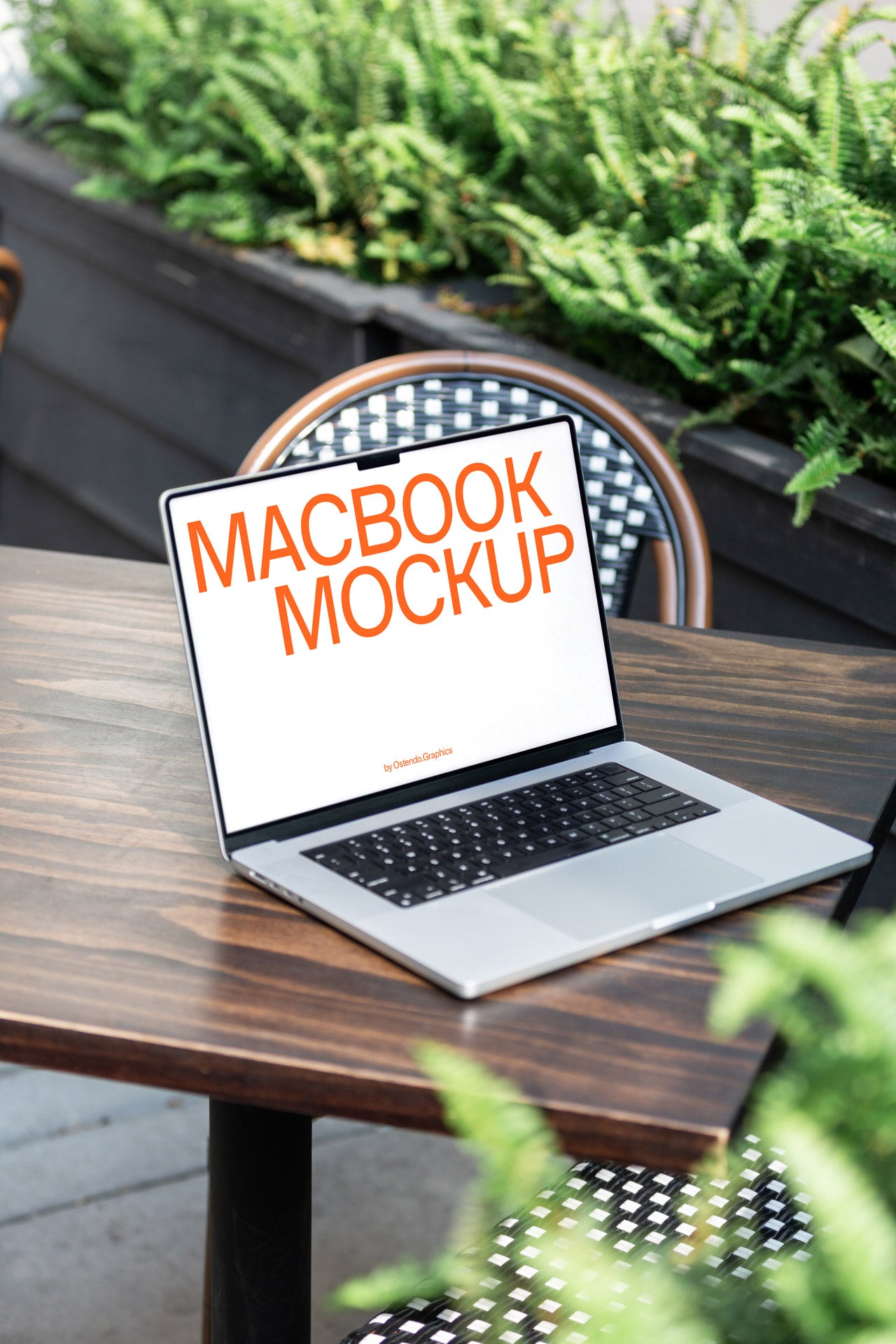 DD39 Macbook Pro Mockup on an Outdoor Table Café