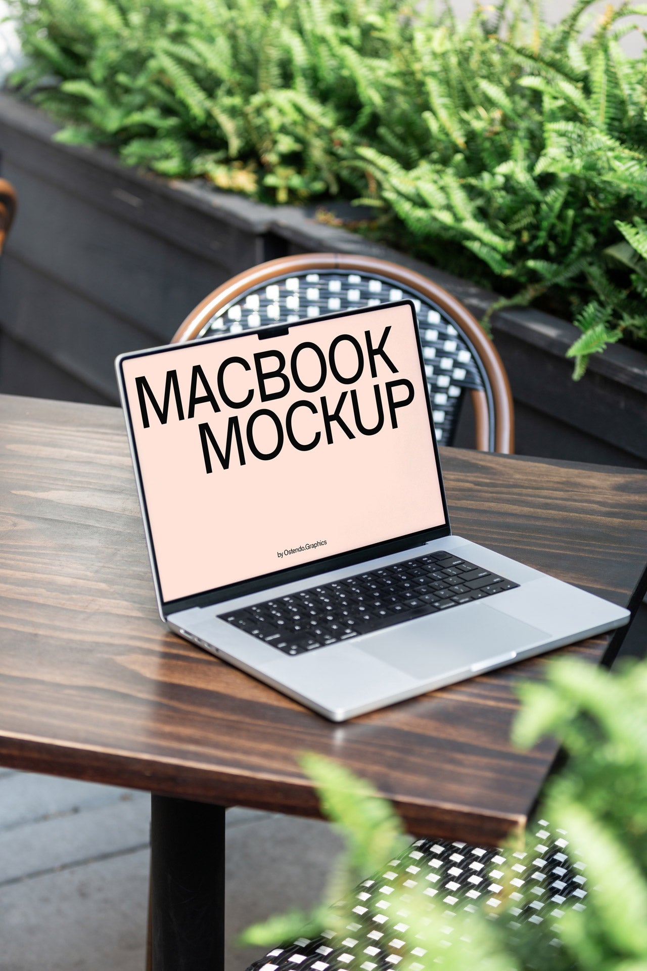 DD39 Macbook Pro Mockup on an Outdoor Table Café