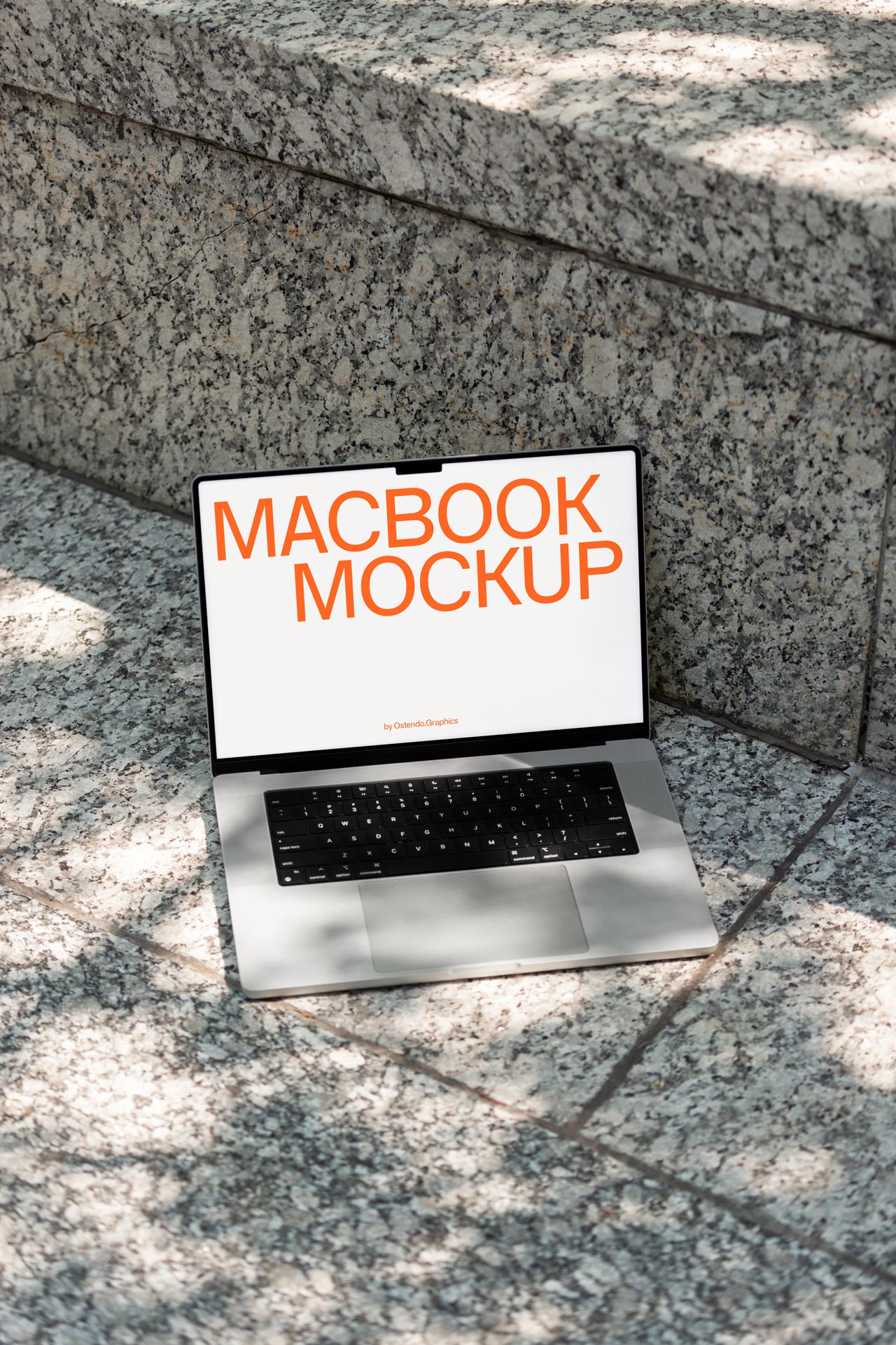 DD40 Macbook Pro Mockup on Urban Outdoor Stone