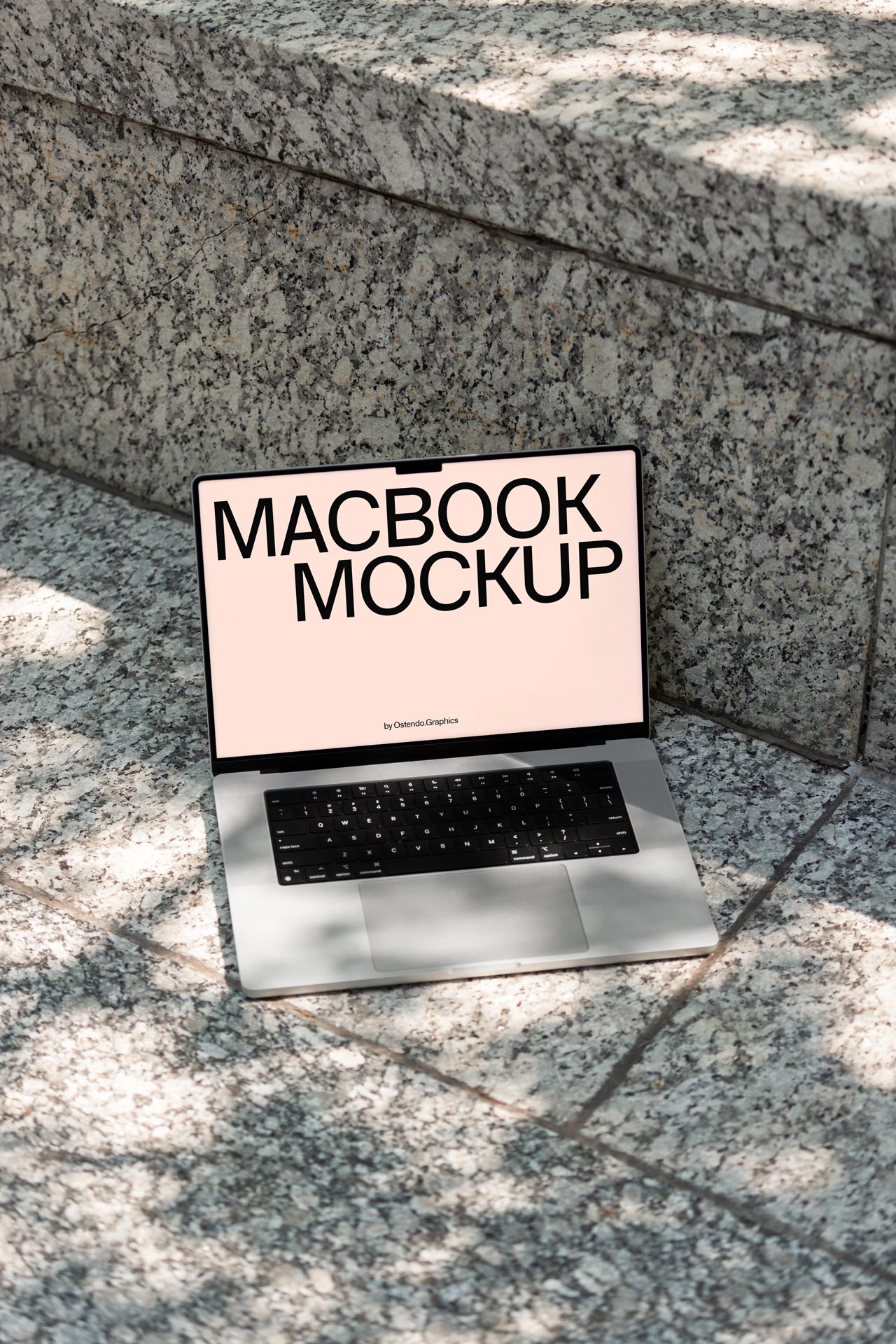 DD40 Macbook Pro Mockup on Urban Outdoor Stone