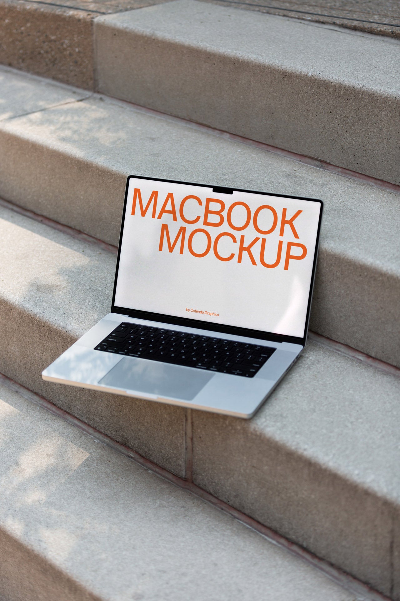 DD44 Macbook Pro Mockup on Concrete Steps