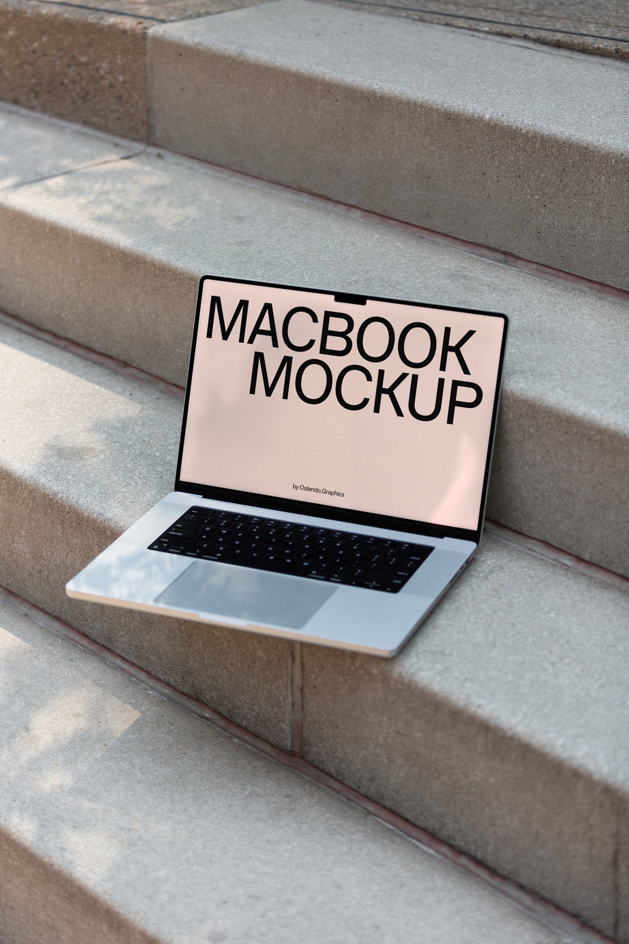 DD44 Macbook Pro Mockup on Concrete Steps