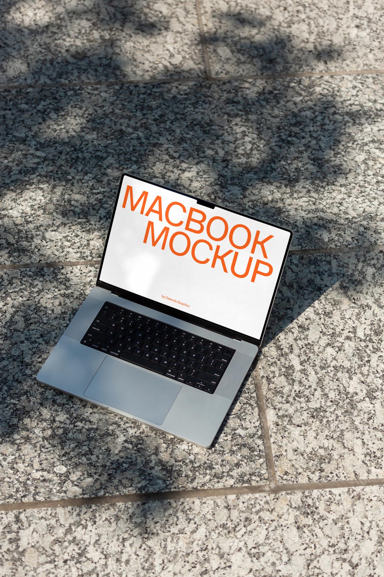 DD47 Macbook Pro Mockup on Stone Courtyard (Free)