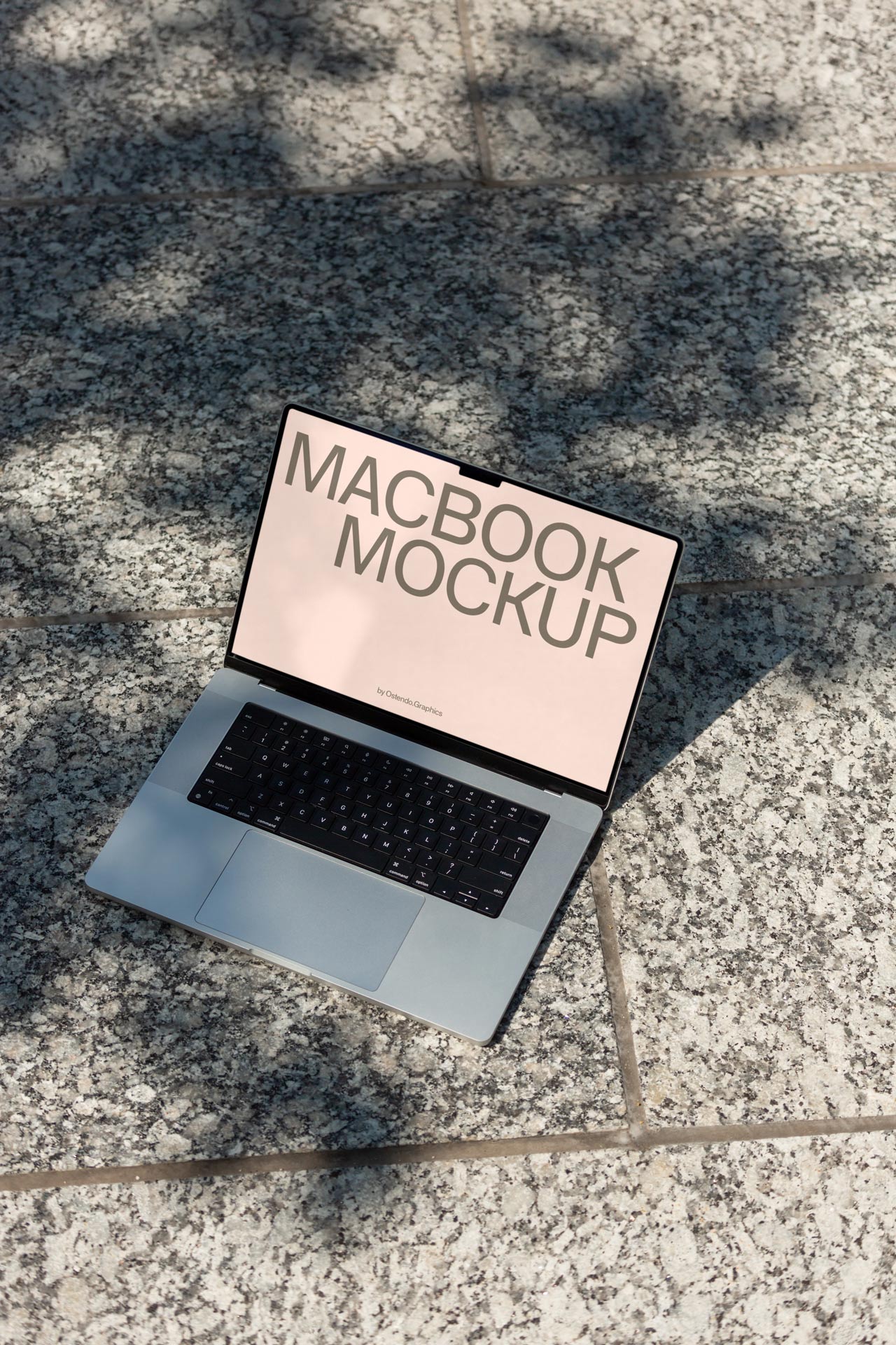 DD47 Macbook Pro Mockup on Stone Courtyard (Free)