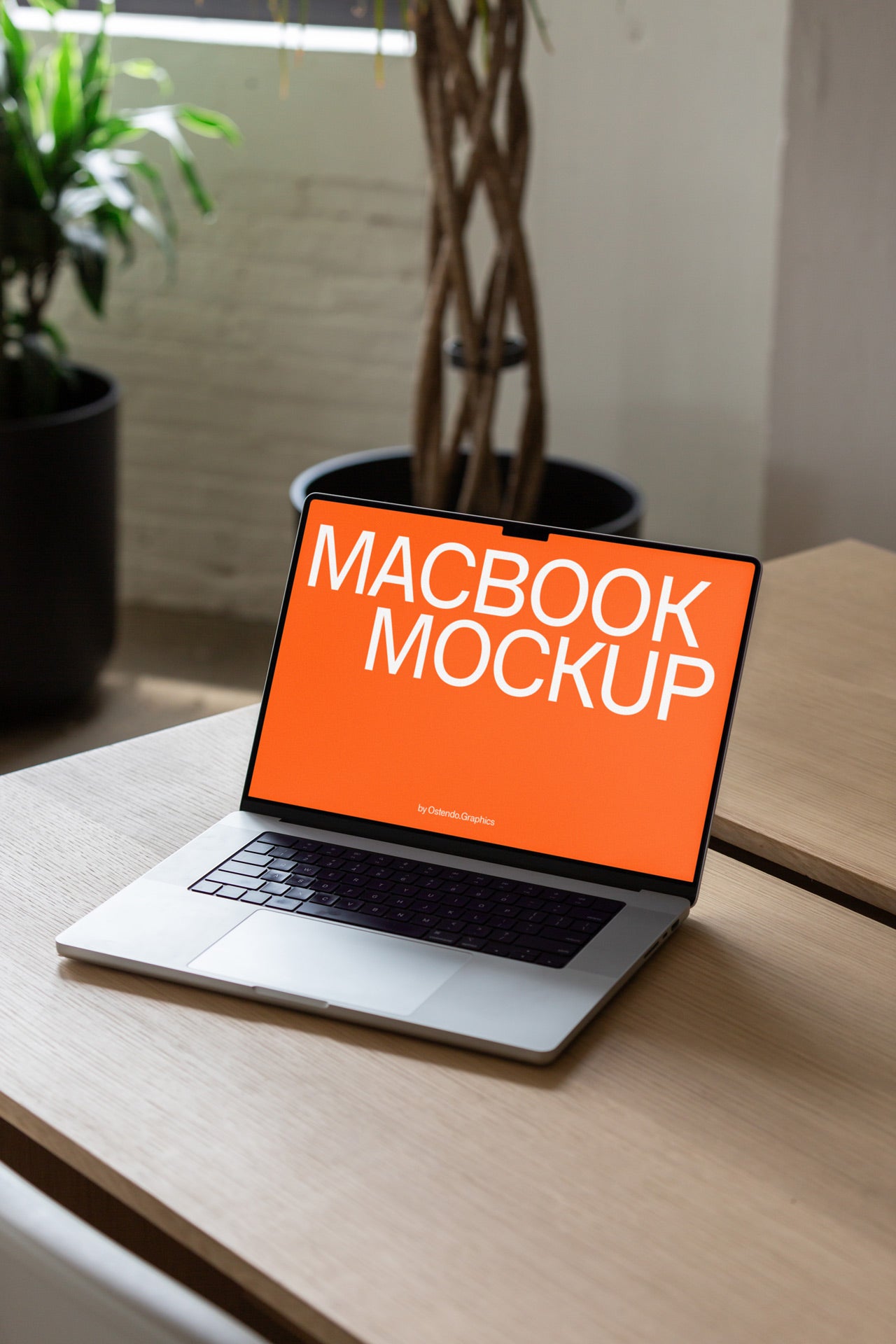 DD52 Macbook Pro Mockup on a Bright Modern Table