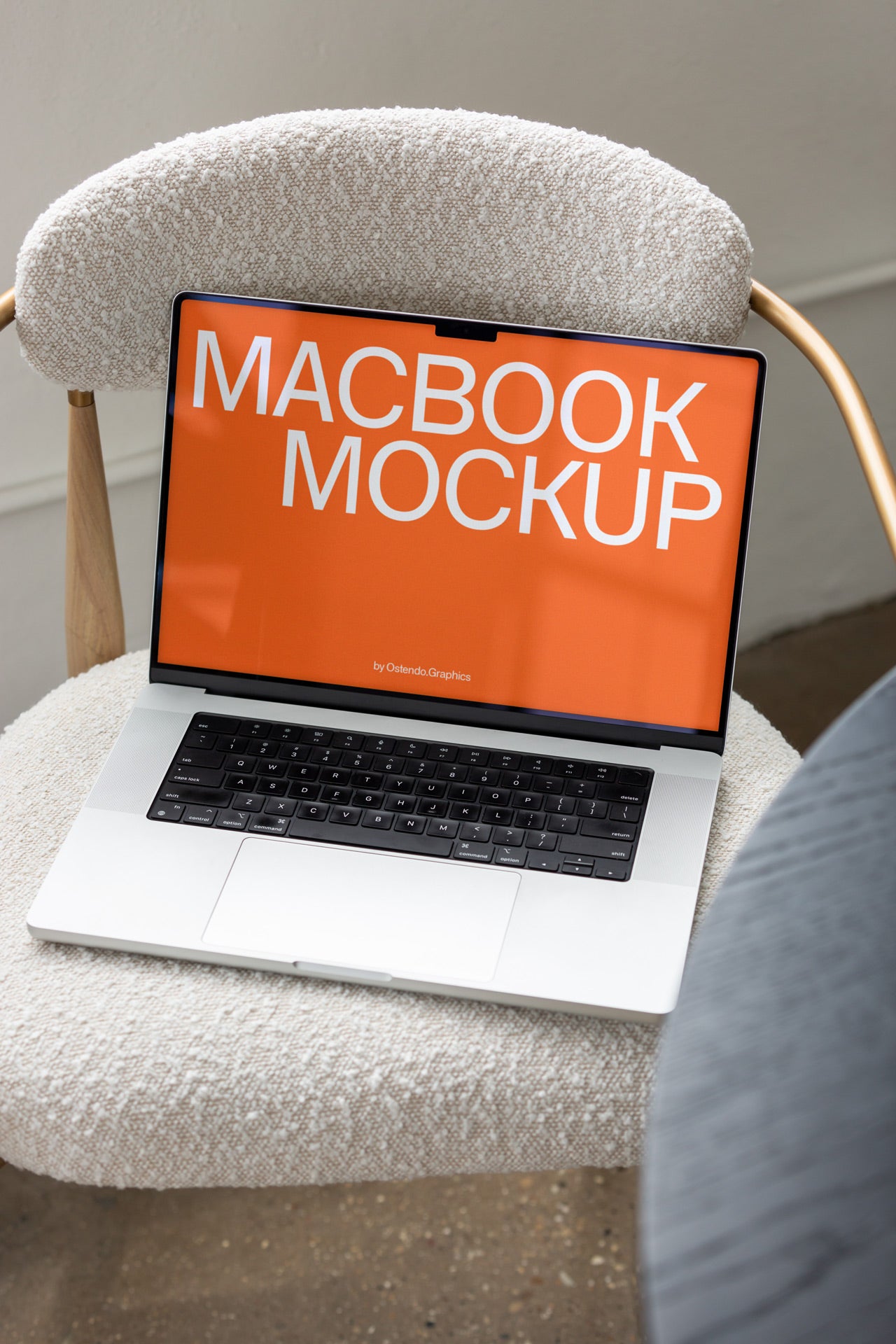 DD54 Macbook Pro Mockup on a Chair