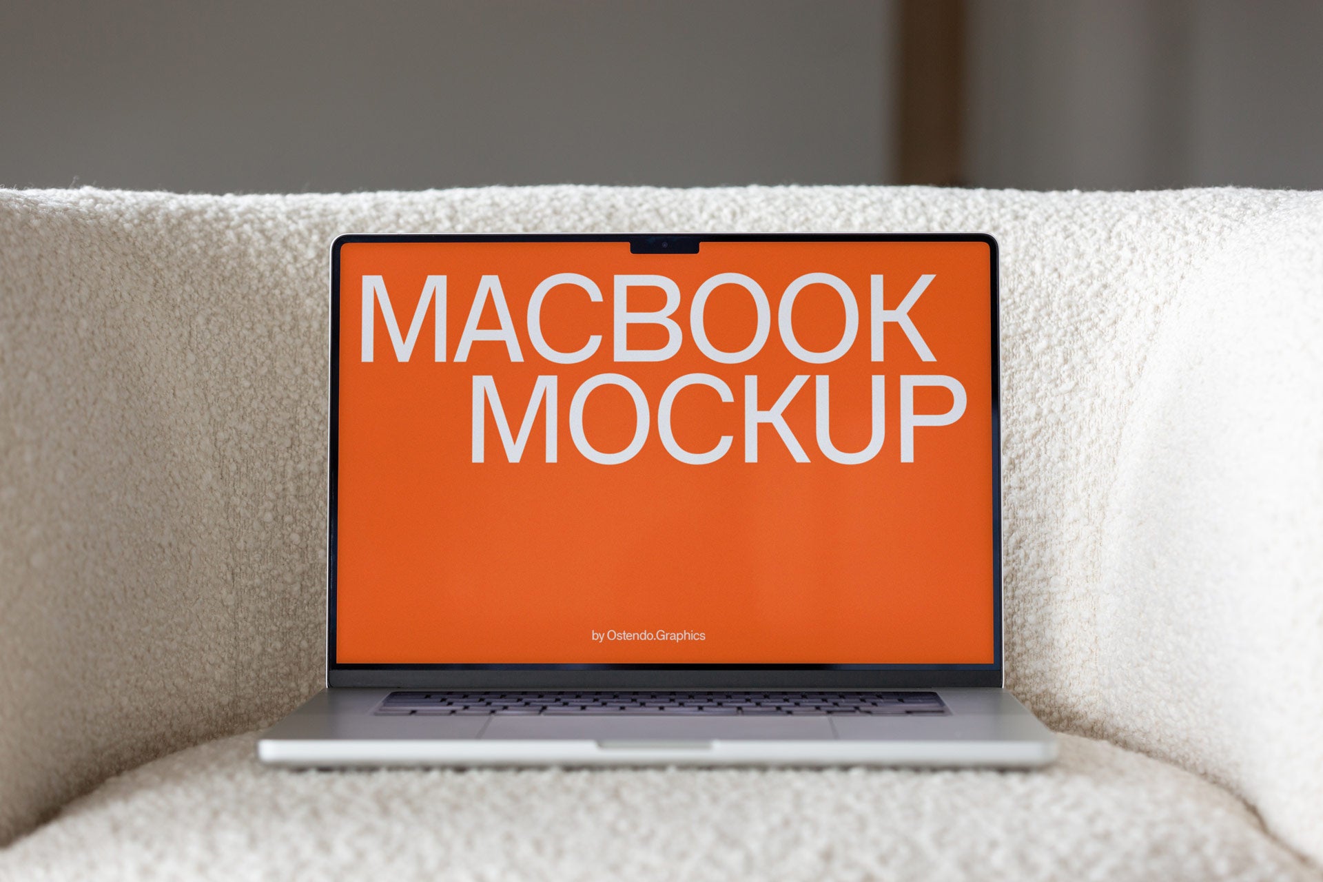 DD60 Macbook Pro Mockup on Soft Couch