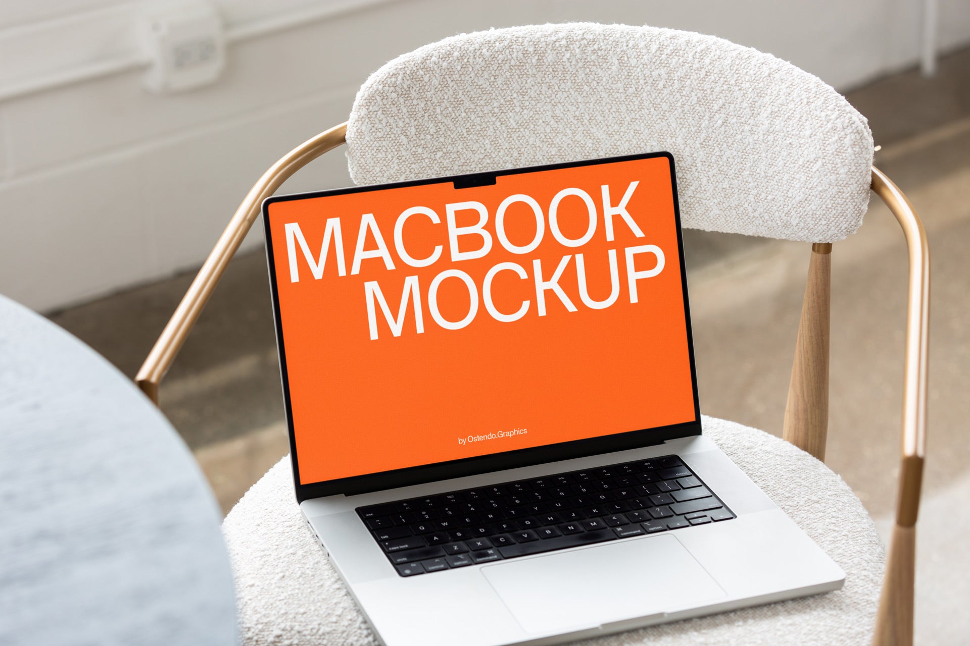 DD67 Macbook Pro Mockup on a White and Brass Chair